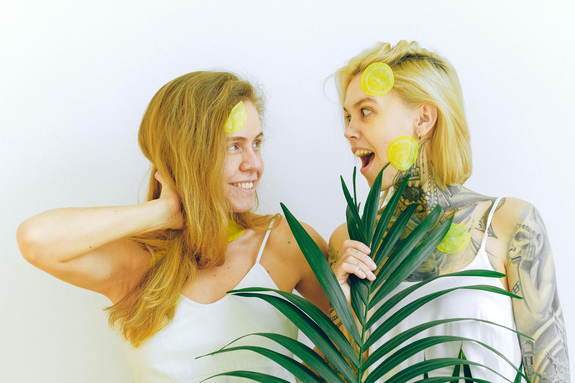 Two women smiling with joy, expressing confidence and freedom