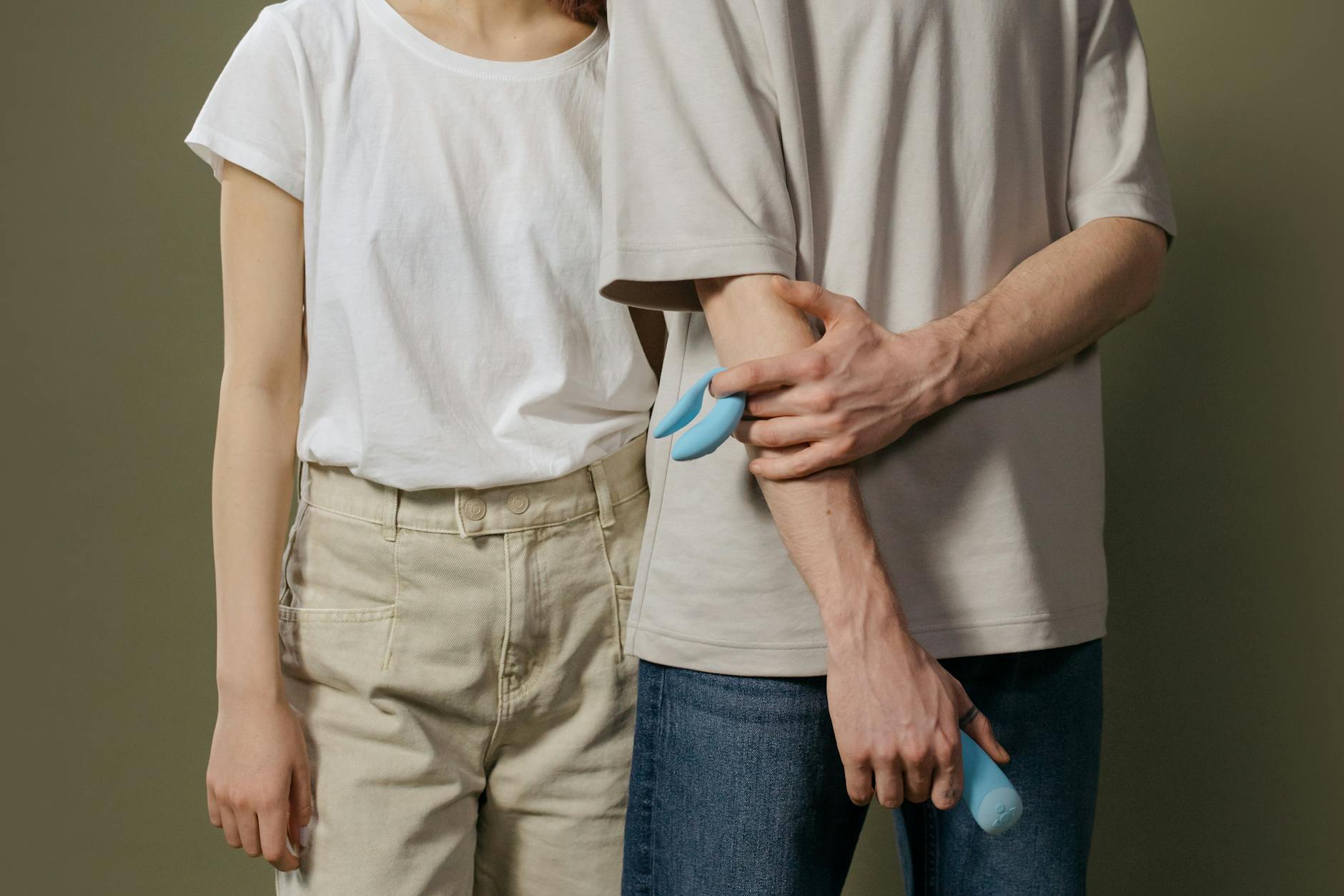 A couple holding a lemon vibrator together, symbolizing shared intimacy and trust.